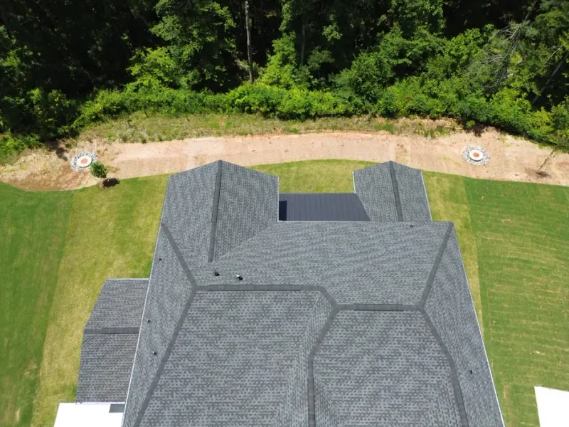 Best Roswell Roofer team performing a free roof inspection on a residential home in Roswell, GA